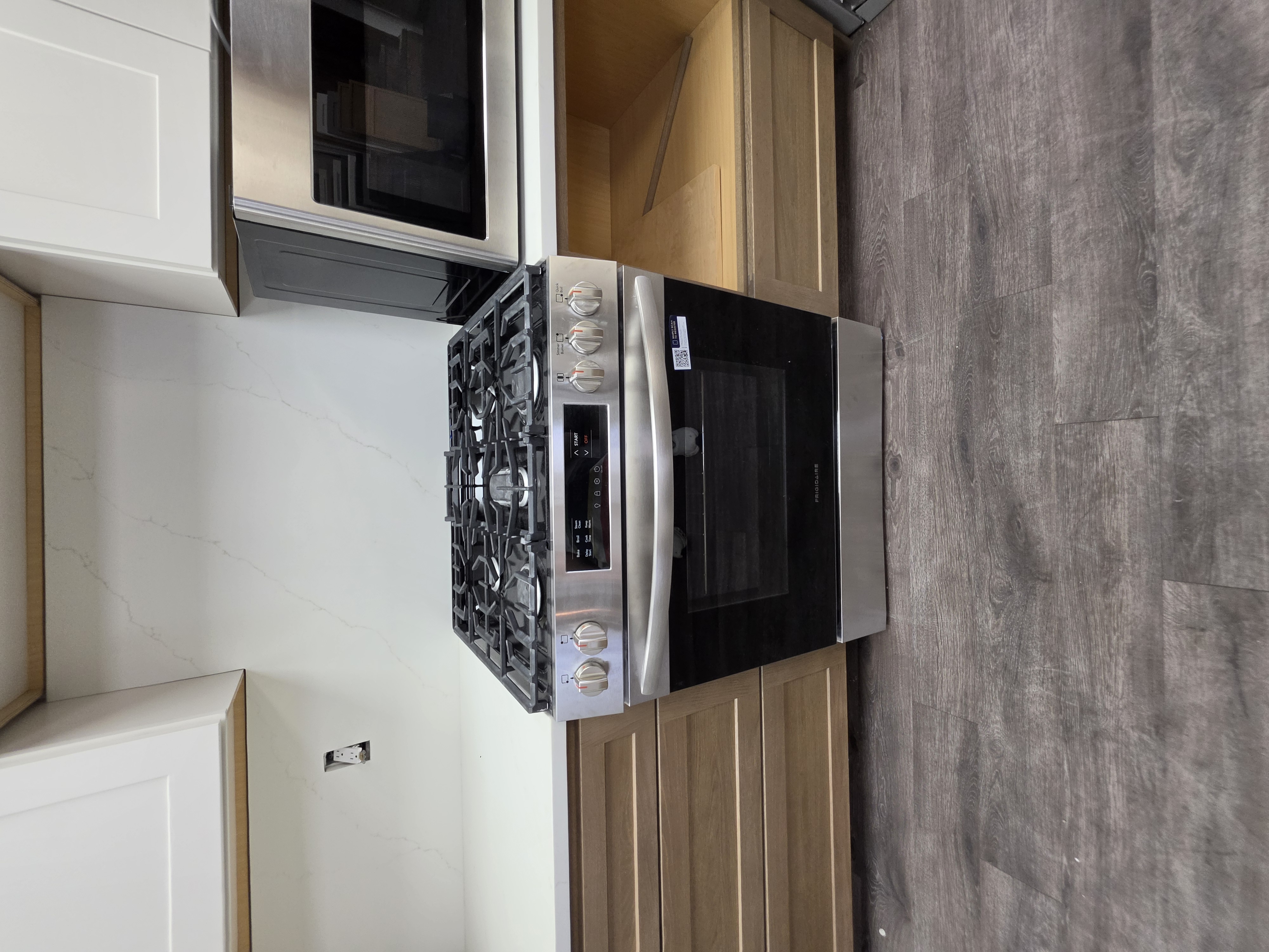 Stainless slide-in gas range from a Millhurst Trading appliance lot