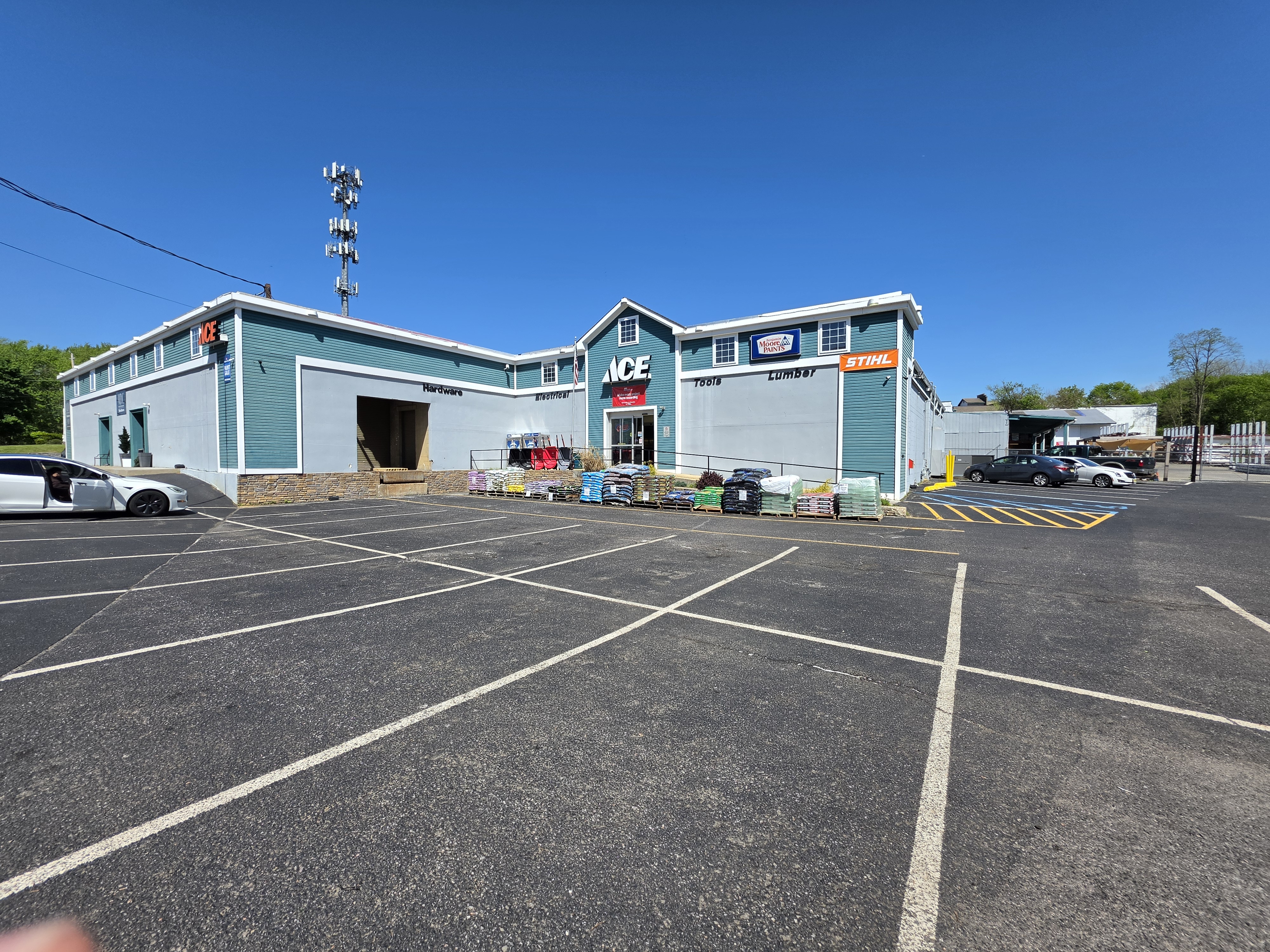 Wide view of the Millhurst Mills lumber yard and store